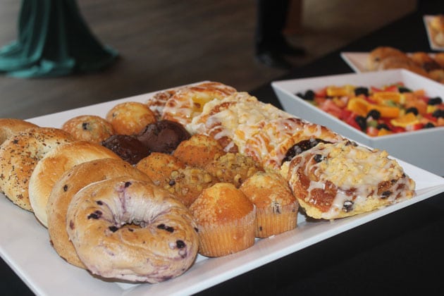 Bagels, muffins and Danishes on a white tray