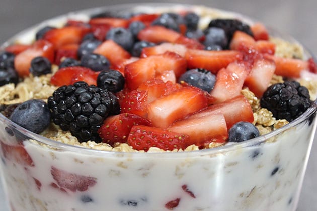 Yogurt trifle with granola, blackberries, strawberries and blueberries