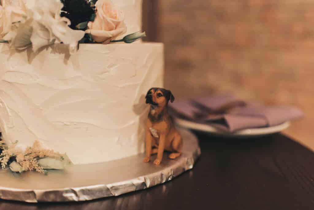 wedding cake with small dog figurine