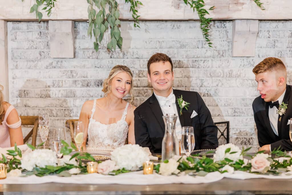 bride and groom at reception table