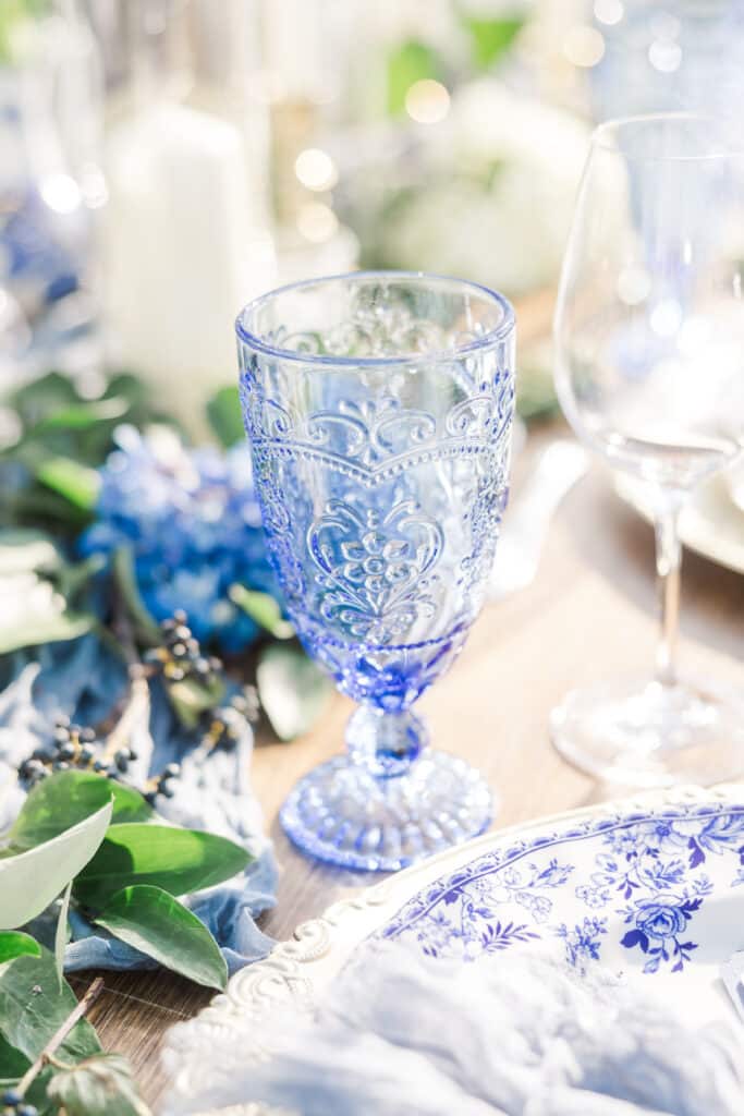 blue glass cup on dining table