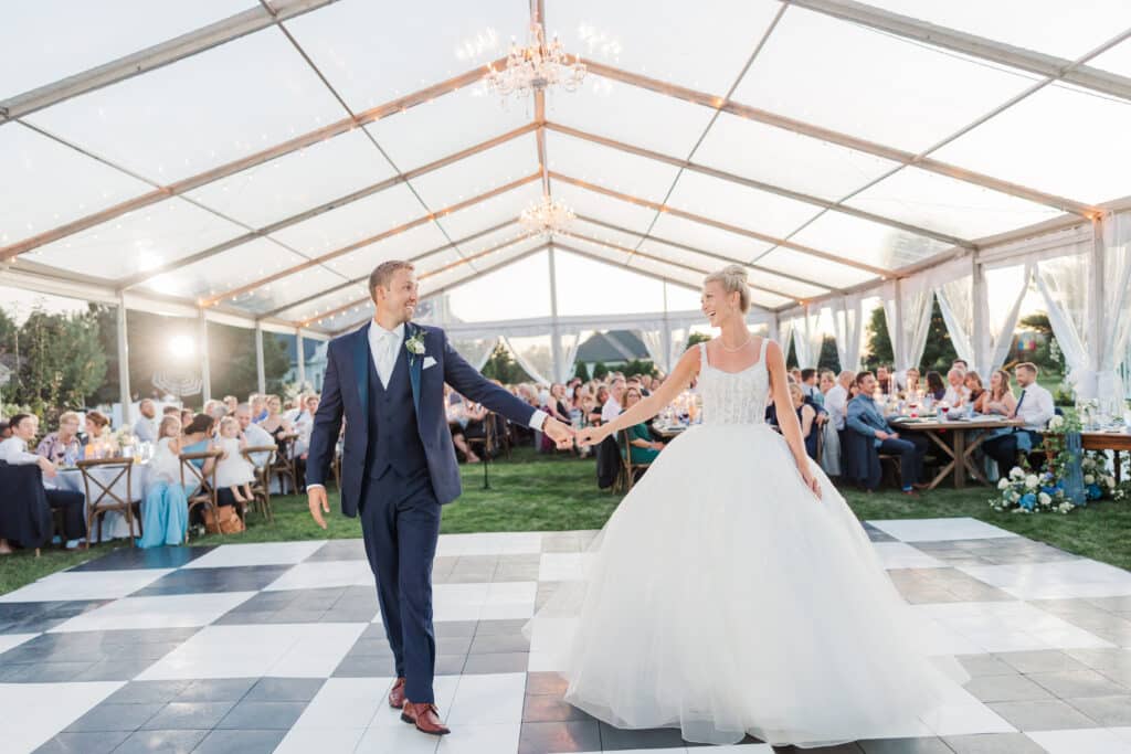 bride and groom on checkered dancefloor