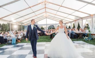 bride and groom on checkered dancefloor
