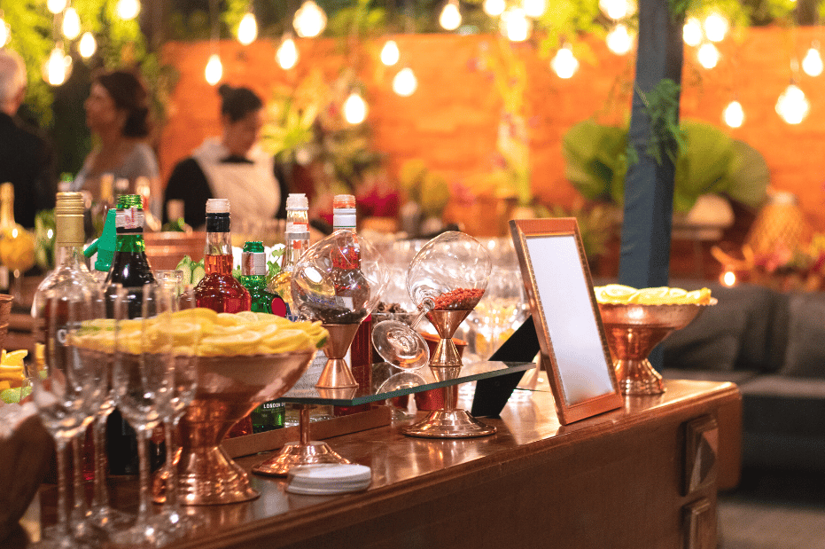 backyard wedding bar with drinks on display