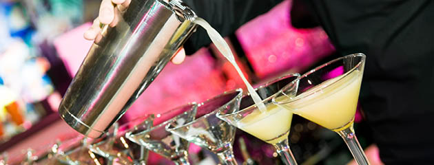 bartender pouring martinis