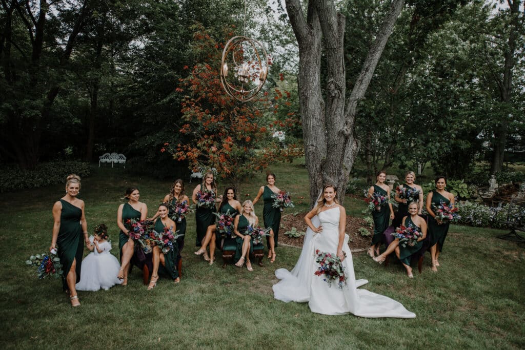 Bride with bridesmaids in backyard.