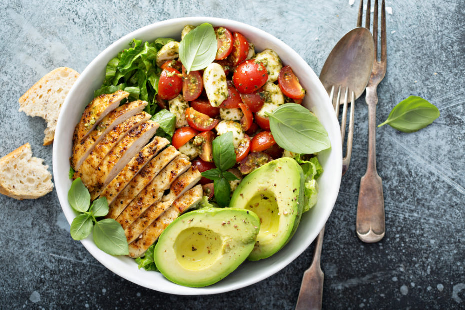 Healthy salad with grilled chicken, avocado and tomatoes