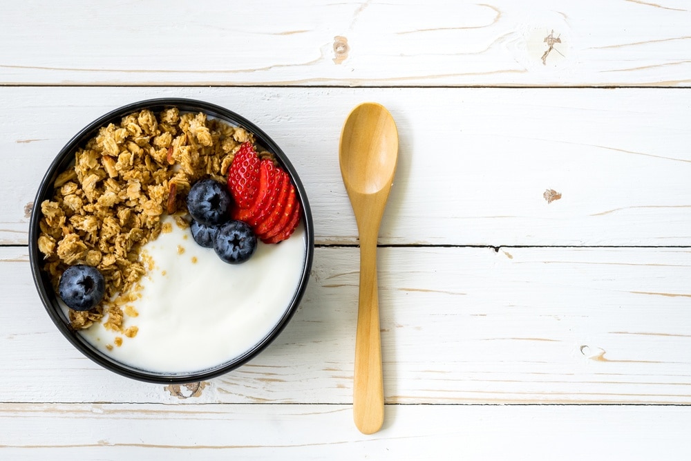 Bowl of yogurt with granola and fresh fruit